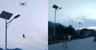 有片-廣西男子被洪水困至險境-無人機緊急-吊人-成功救援