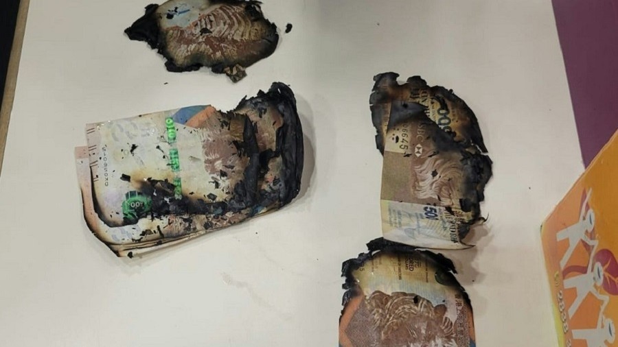 天降鈔票｜警方鯉魚門邨檢逾8.8萬紙幣「大牛」部分被燒焦　列刑毀案處理