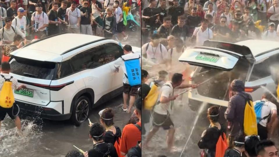 有片--西雙版納潑水節亂象頻生-私家車被強開車門狂灌水-路過女子遭圍攻惹眾怒